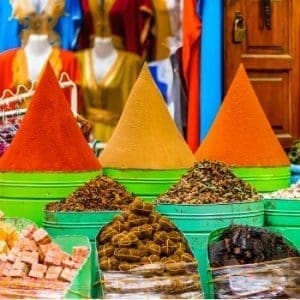 Colourful spices at a market in Marrakech, Morocco. Marrakech is a top destination for street food.