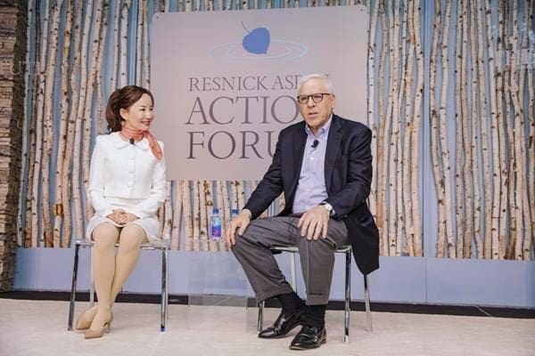 Ctrip CEO Jane Sun (left) in conversation with Co-Chairman of the Carlye Group, David Rubenstein